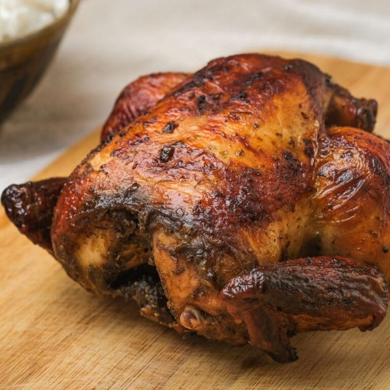 Square image of a roasted whole chicken.