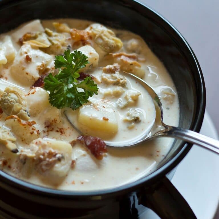 Square image of a bowl of clam chowder.