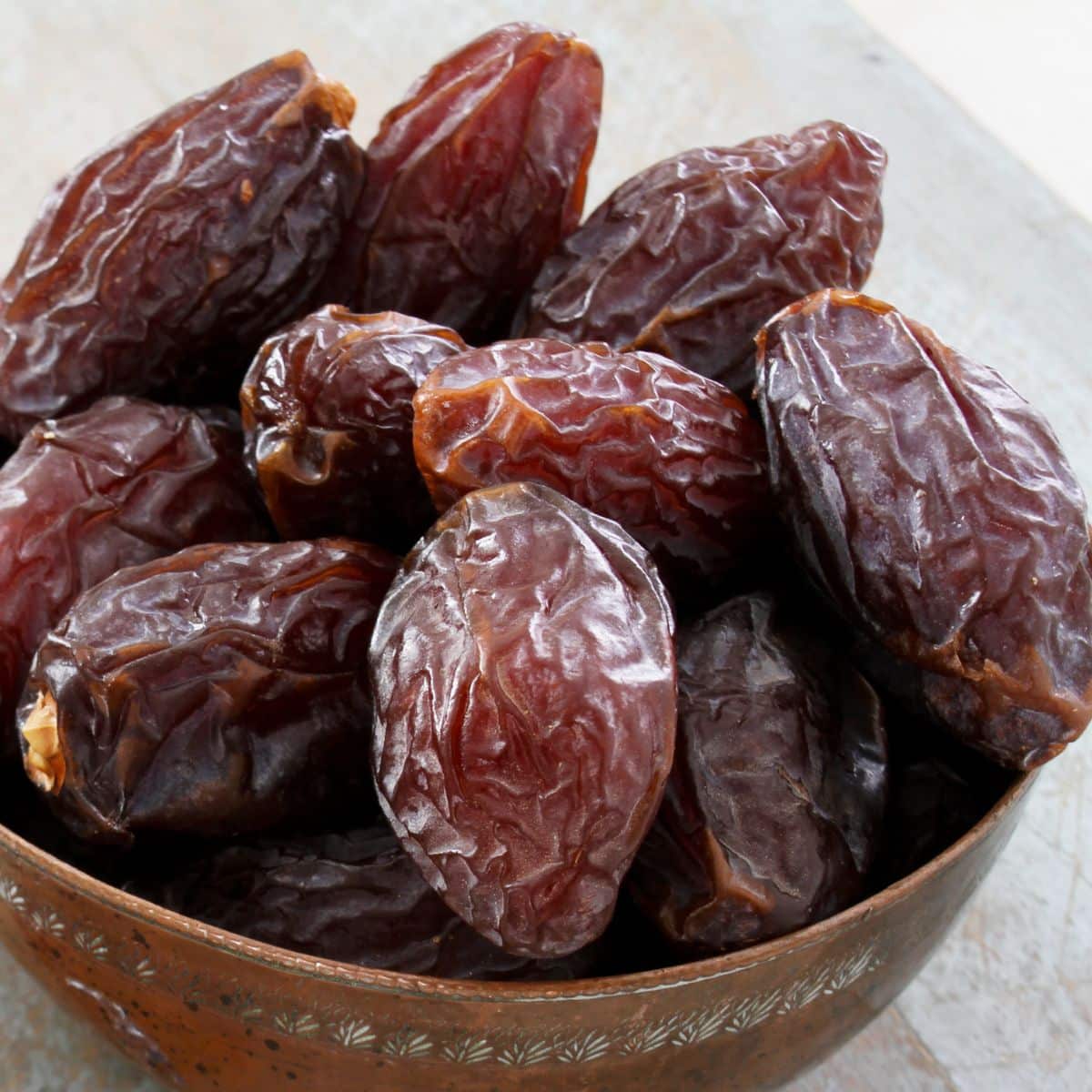 Square image of a bowl of dates.